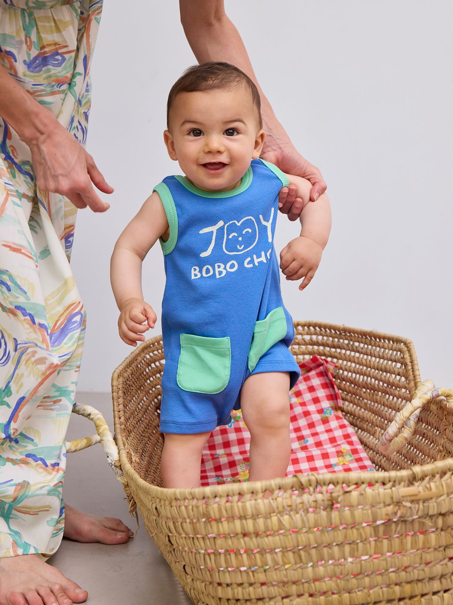 Smiling blue playsuit